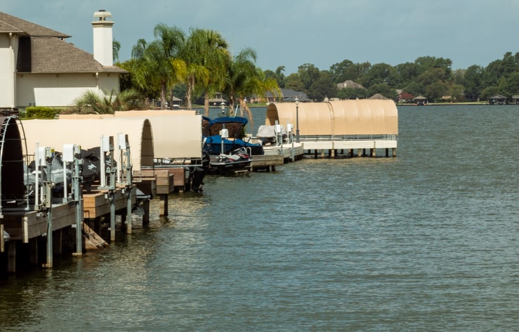 View of boats docked in a series of piers at Lake Conroe, TX.
